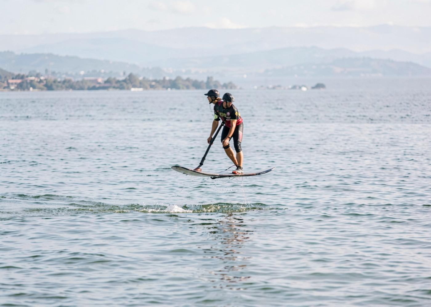 Hydrofoil board rider above the surface