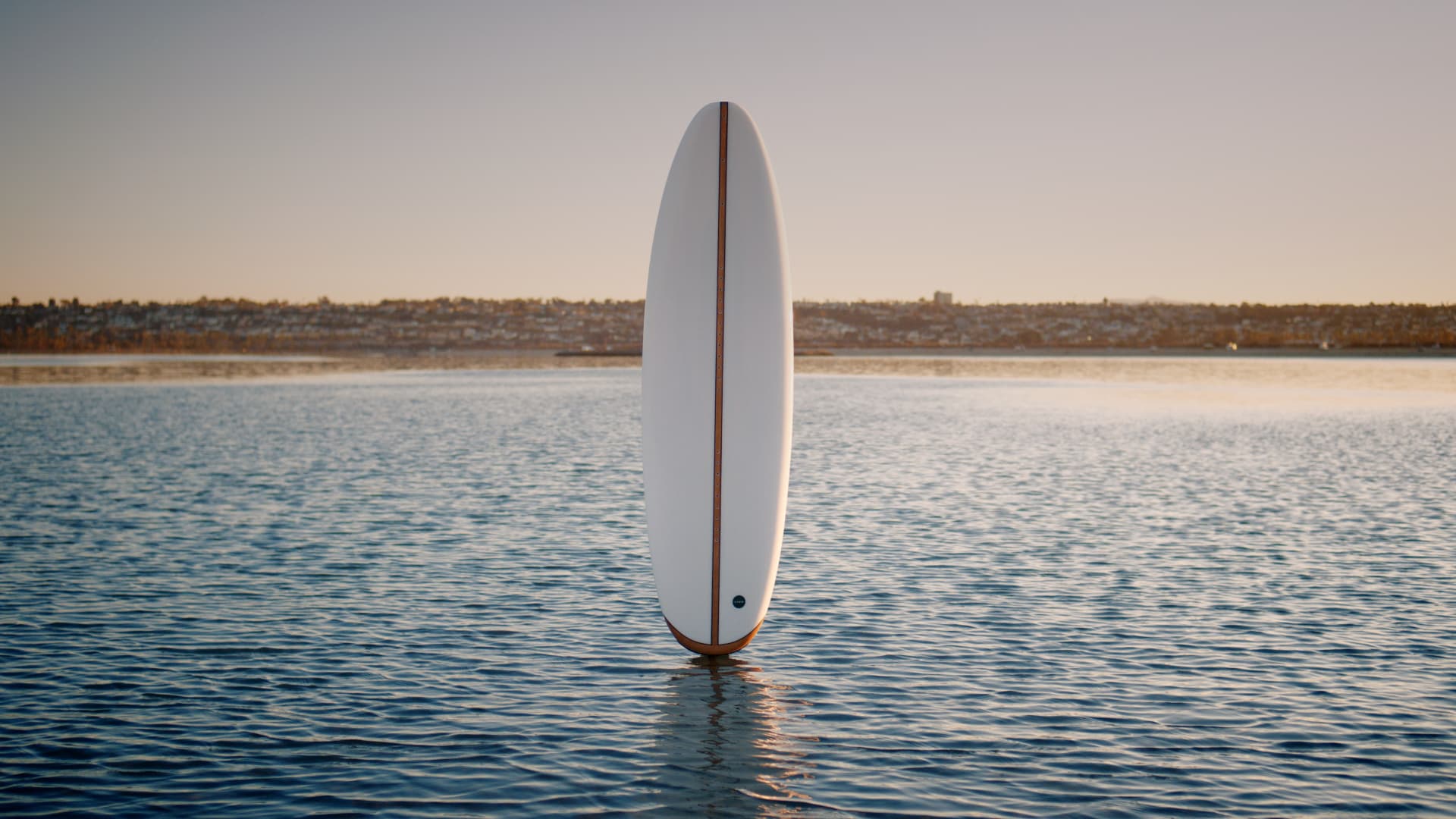 LIND electric surfboard at sunset