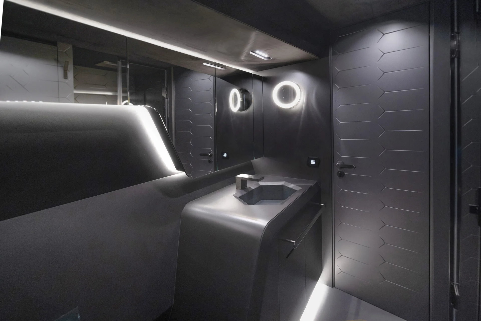 Dark hexagonal panelling and materials aboard the yacht