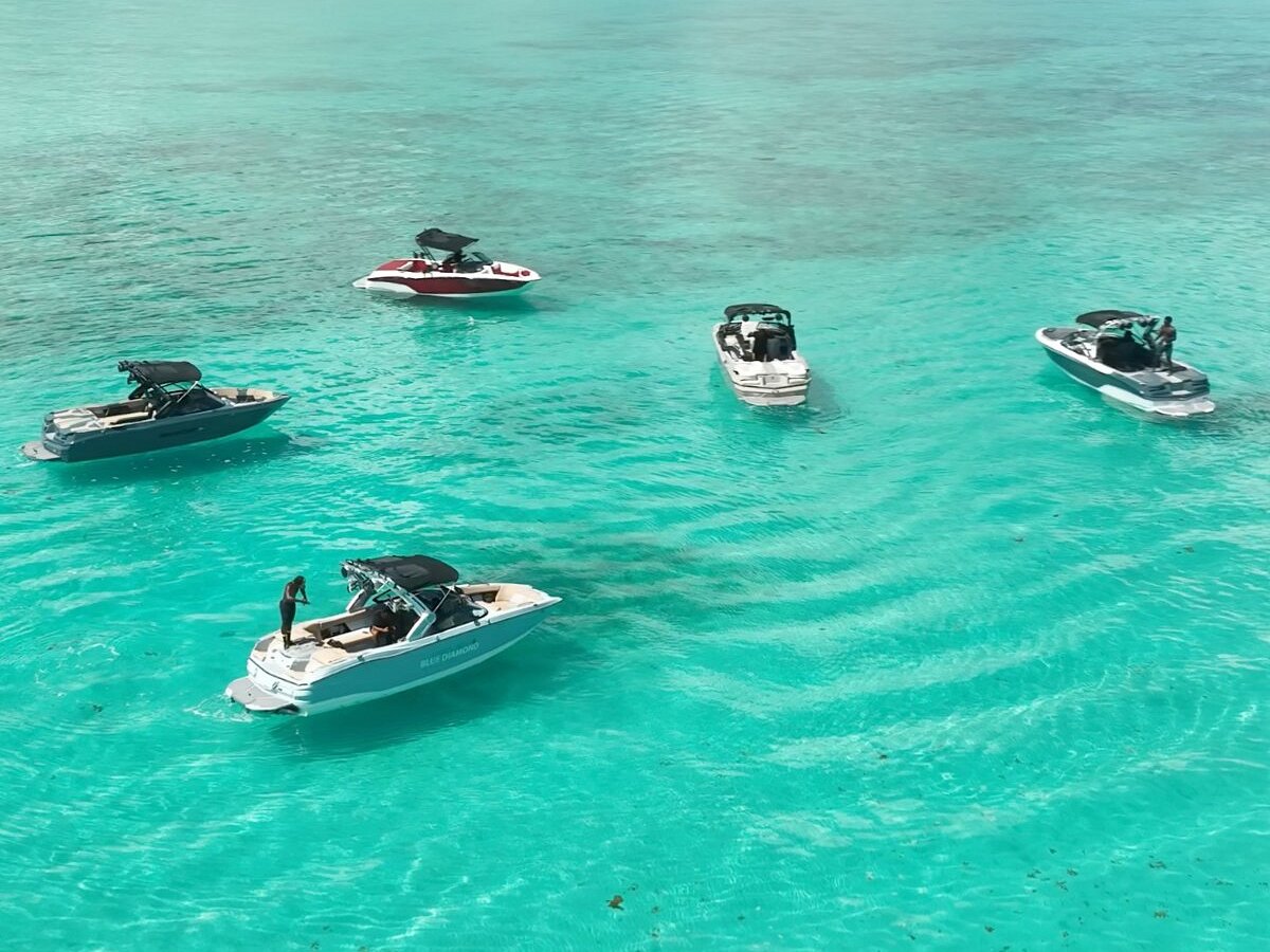 MasterCraft wake boats gathered in turquoise Caribbean water