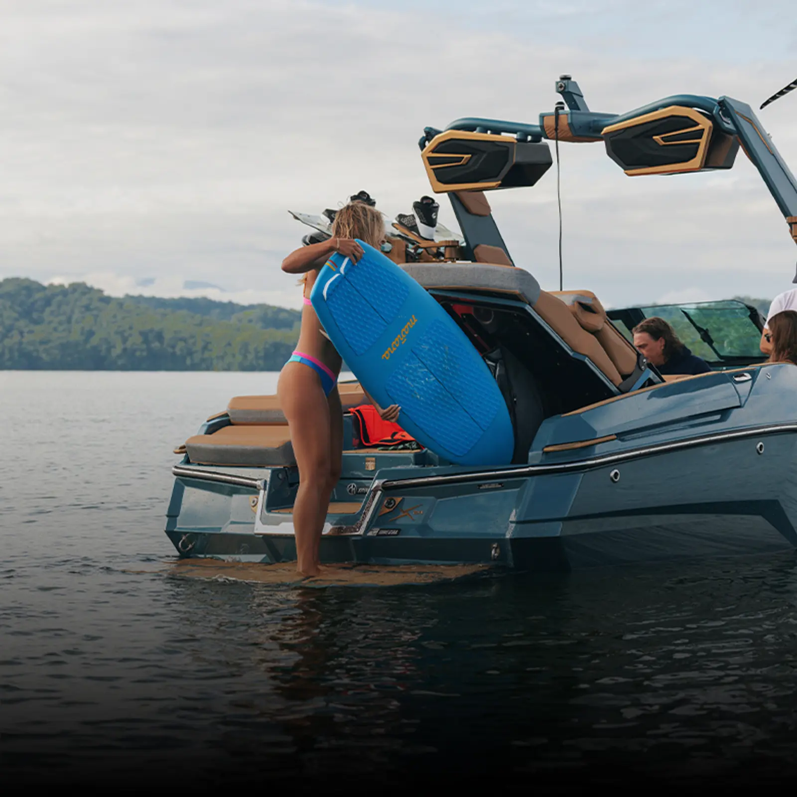 Swim stop alongside the X24 with a board in the water
