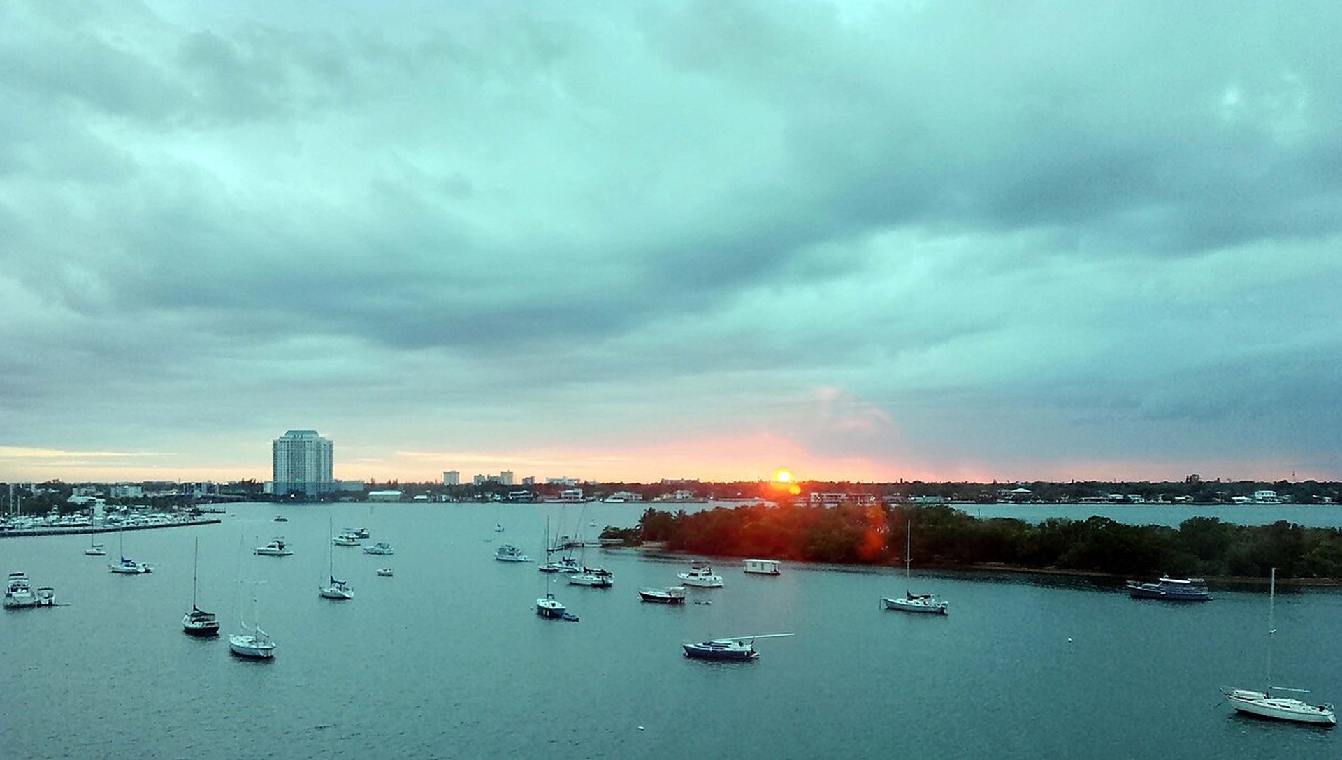 Boats at anchor on Biscayne Bay at sunset