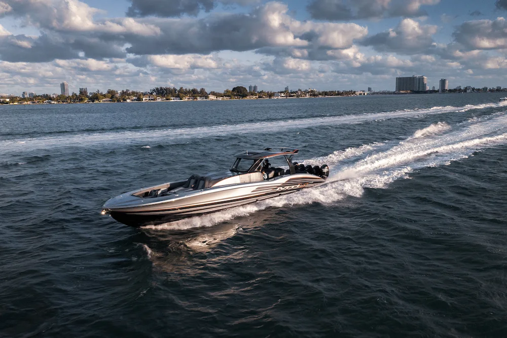 MTI performance boat running across open water in late light