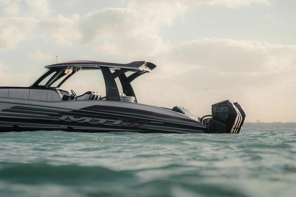 MTI performance center console on calm water at dusk