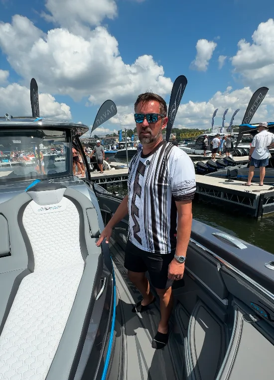 Owner aboard an MTI at the dock during an event