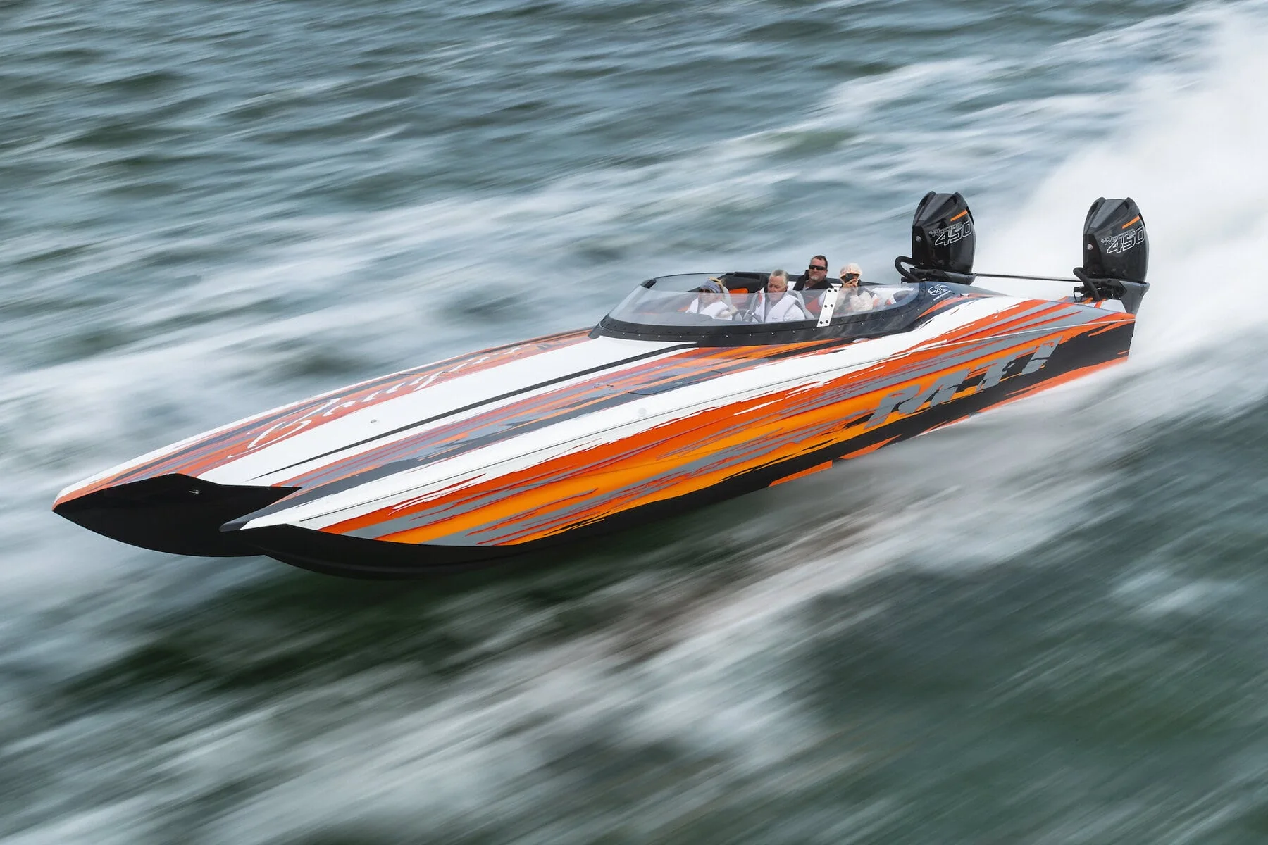 MTI performance catamaran running at speed across open water