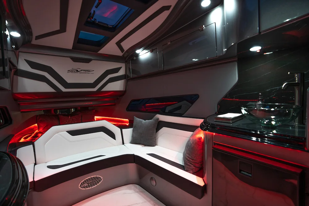 Custom cockpit interior with red accent lighting aboard an MTI