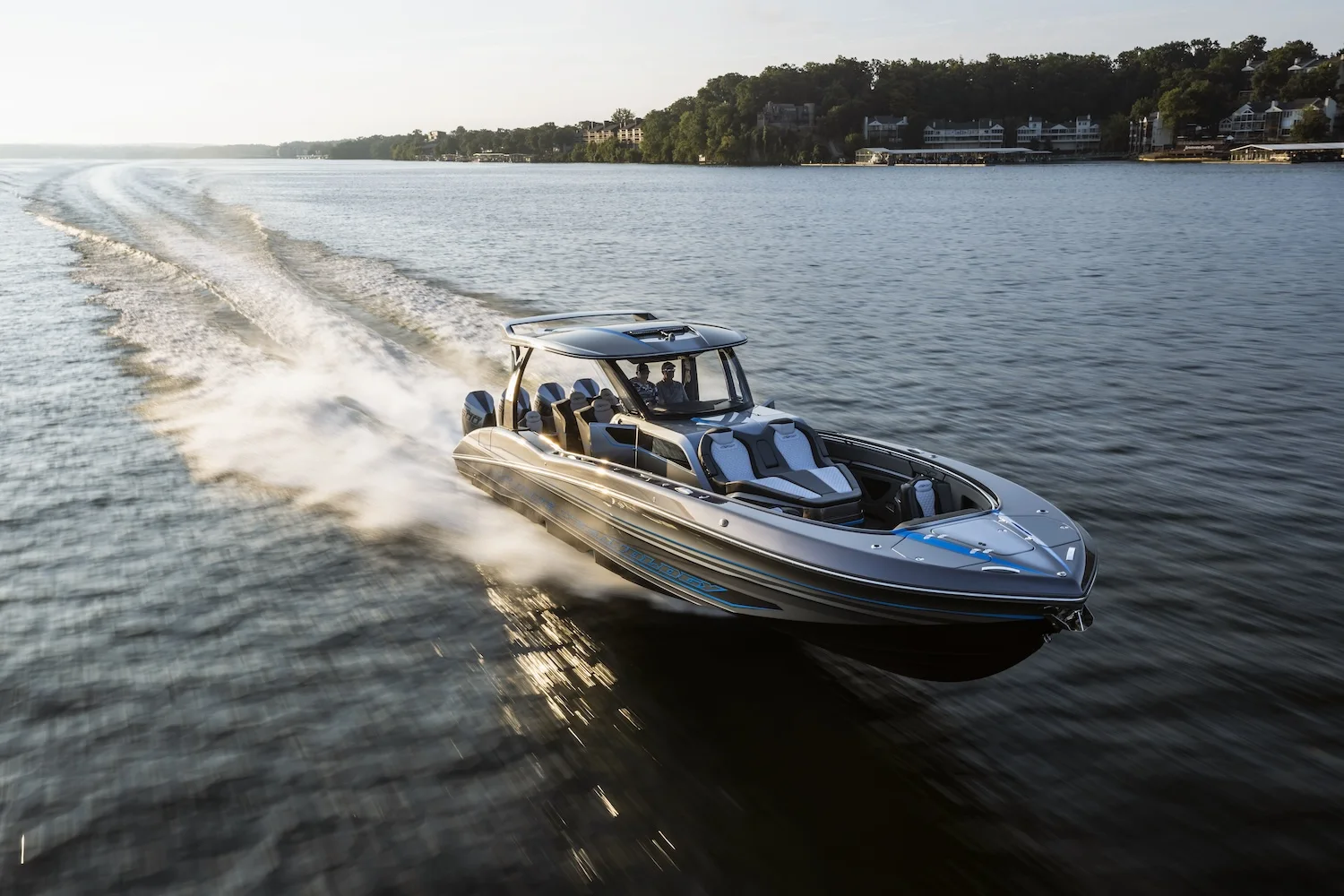 MTI performance boat underway on a calm lake