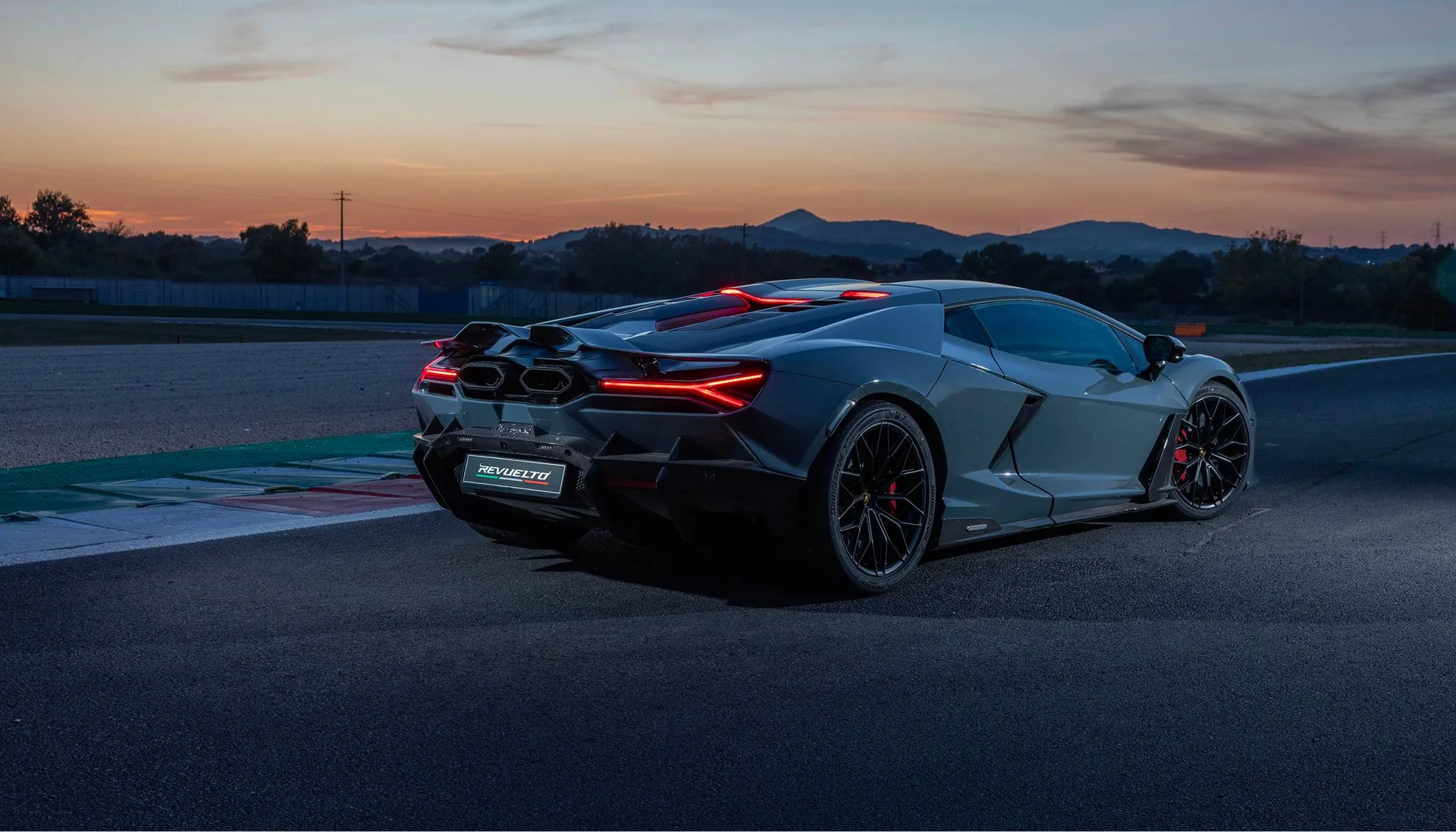 Lamborghini Revuelto on a racetrack at sunset