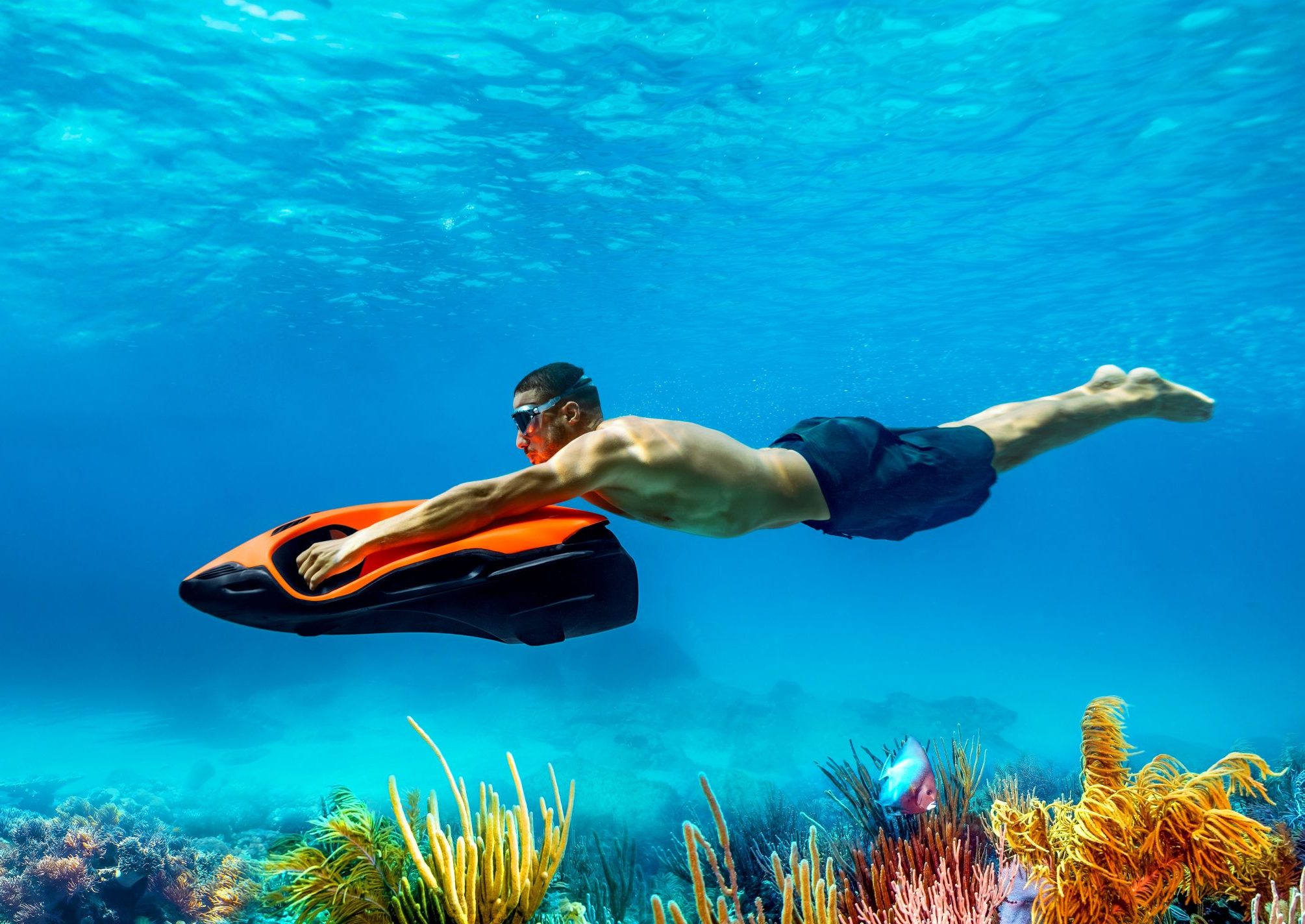 Rider exploring underwater above a reef on a SEABOB