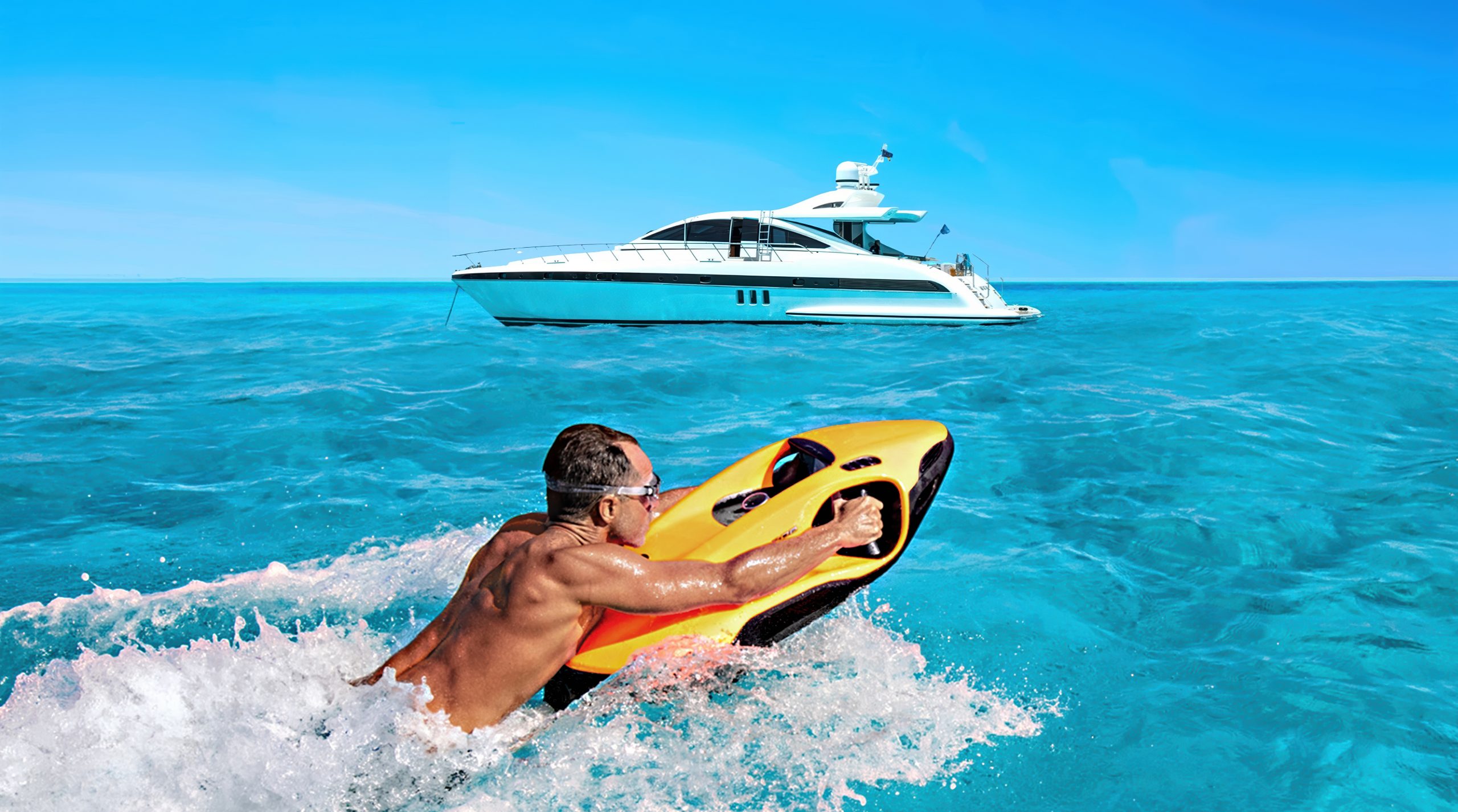 Rider on a SEABOB across clear water with a yacht behind
