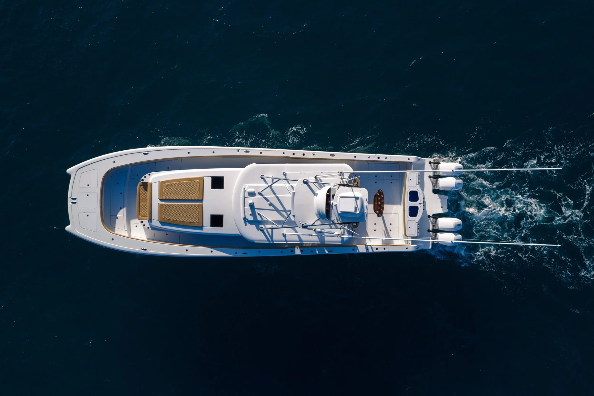 Overhead view of a Freeman catamaran running, showing its twin hulls and outboards