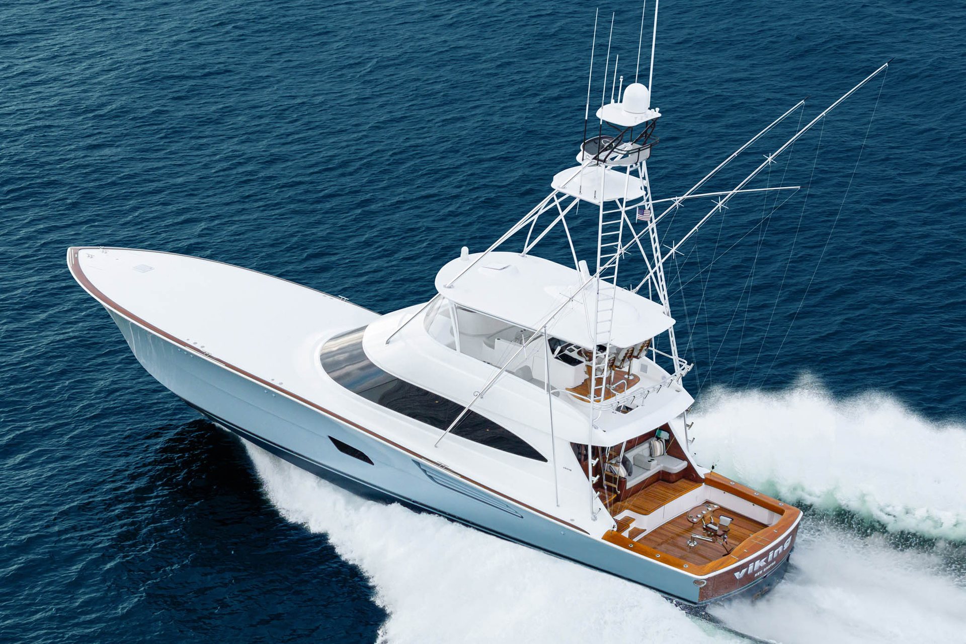 Viking sportfishing convertible running hard across deep blue offshore water