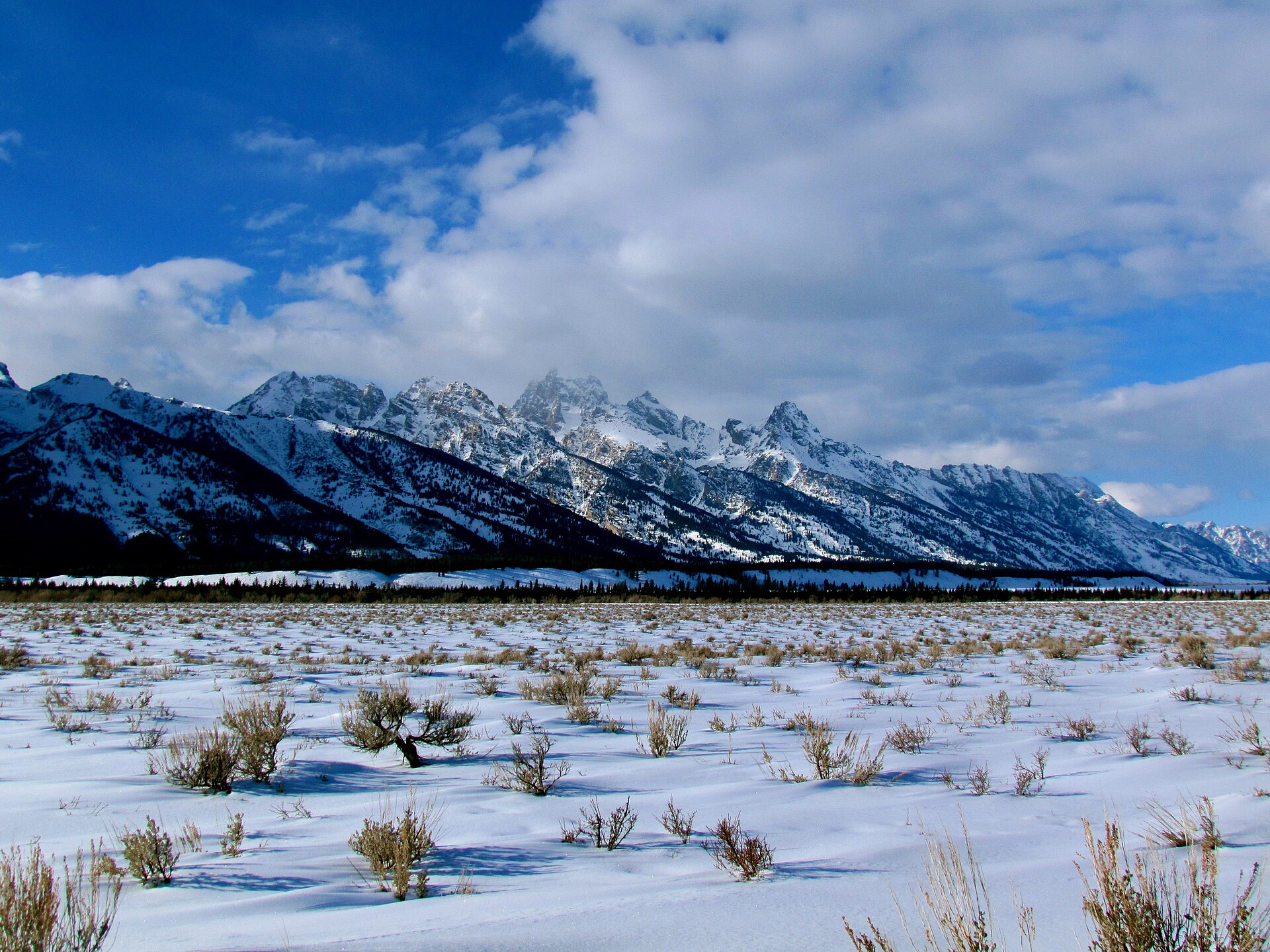 The Teton Range rising above the winter valley floor in Wyoming