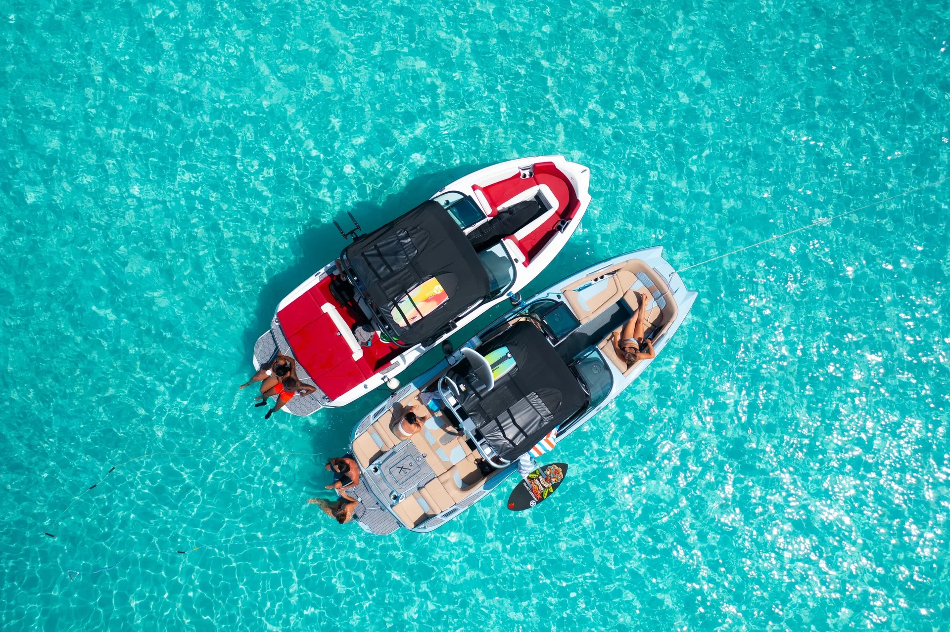 Two Wake to Wake wakeboats side by side in turquoise water off Providenciales